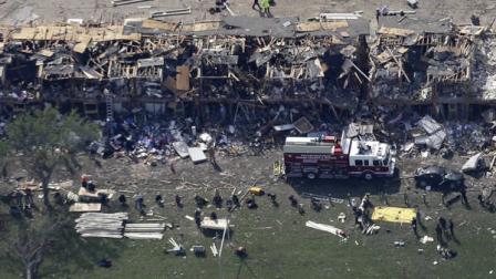This aerial photo shows the remains of a fertilizer plant destroyed by an explosion and an emergency responders vehicle, bottom left, in West, Texas, Thursday, April 18, 2013. Rescuers searched the smoking remnants for survivors of Wednesday nights thunderous fertilizer plant explosion, gingerly checking smashed houses and apartments for anyone still trapped in debris while the community awaited word on the number of dead. (AP Photo/Tony Gutierrez)