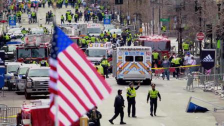 Emergency workers aid injured people at the finish line of the 2013 Boston Marathon following an explosion in Boston, Monday, April 15, 2013.