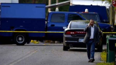 Everett Dutschke walks to a neighbors house Tuesday, April 23, 2013 in Tupelo, Miss., as he waits for federal authorities to finish searching his home in connection with the recent ricin attacks. (AP Photo/Rogelio V. Solis)