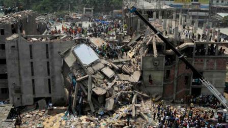 Bangladesh rescuers look for survivors and victims at the site of a building that collapsed Wednesday in Savar, near Dhaka, Bangladesh,Thursday, April 25, 2013. By Thursday, the death toll reached at least 194 people as rescuers continued to search for injured and missing, after a huge section of an eight-story building that housed several garment factories splintered into a pile of concrete. (AP Photo/A.M.Ahad)