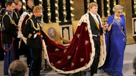Dutch King Willem-Alexander and his wife Queen Maxima stand inside the Nieuwe Kerk or New Church in Amsterdam, The Netherlands, for his inaugurationTuesday April 30, 2013. Around a million people are expected to descend on the Dutch capital for a huge street party to celebrate the first new Dutch monarch in 33 years. (AP Photo/Peter Dejong, Pool)