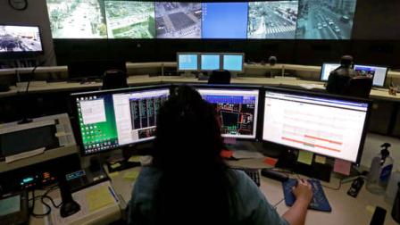 This Wednesday, April 24,2013 photo shows transportation engineer associate Abeer Kliefe working at the Los Angeles Department of Transportations Automated Traffic Surveillance and Control Center in downtown Los Angeles. In small towns and big cities, police and politicians are pointing to the surveillance video that was key to identifying the Boston Marathon bombing suspects as a reason to bolster their own networks and get more electronic eyes on their streets. (AP Photo/Reed Saxon)