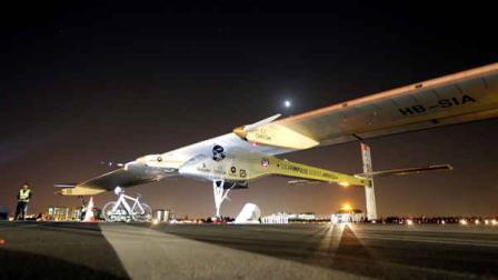 The Solar Impulse plane sits on the tarmac early in the morning before takes off on a multi-city trip across the United States from Moffett Field NASA Ames Research Center in Mountain View, Calif., Friday, May 3, 2013. (AP Photo/Tony Avelar)