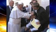 In this image made from video provided by APTN, Pope Francis lays his hands on the head of a young man on Sunday, May 19, 2013, after celebrating Mass in St. Peters Square. The young man heaved deeply a half-dozen times, convulsed and shook, and then slumped in his wheelchair as Francis prayed over him. The television station of the Italian bishops conference said it had surveyed exorcists, who agreed Francis either performed an exorcism or a prayer to free the man from the devil. The Vatican was more cautious Tuesday, saying Francis didnt intend to perform any exorcism. But as he often does for the sick or suffering, he simply intended to pray for someone. (AP Photo/APTN)  