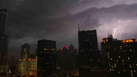 Lightning erupts over downtown Chicago on Wednesday, June 12, 2013, as a line of powerful storms cross over the Midwest. A massive line of storms packing hail, lightning and tree-toppling winds began rolling through the Midwest Wednesday evening and could affect more than one in five Americans from Iowa to Maryland before subsiding. (AP Photo/Dr. Scott M. Lieberman)