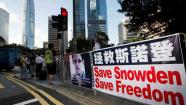 A banner supporting Edward Snowden, a former CIA employee who leaked top-secret documents about sweeping U.S. surveillance programs, is displayed at Central, Hong Kongs business district, Tuesday, June 18, 2013. U.S. President Barack Obama defended top secret National Security Agency spying programs as legal in a lengthy interview, and called them transparent - even though they are authorized in secret. (AP Photo/Kin Cheung)
