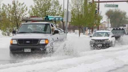 Motorist make their way through hail and high water as a storm dumped hail and heavy rain in Westminster, Colo., north of Denver on Wednesday, May 18, 2011.The storm prompted tornado warnings in the area.(AP Photo/Ed Andrieski)