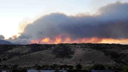 This Tuesday June18, 2013 image provided by the American Red Cross shows wildfire in Prescott, Ariz. This nearly 11-square-mile wildfire in Arizonas Prescott National Forest grew Wednesday as more than 500 firefighters were dispatched to battle the blaze.(AP Photo/American Red Cross, Todd Tamcsin)