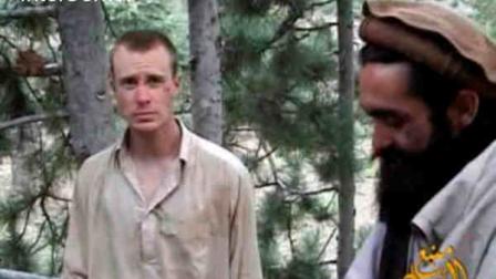 FILE - This file image provided by IntelCenter on Wednesday Dec. 8, 2010 shows a frame grab from a video released by the Taliban containing footage of a man believed to be Bowe Bergdahl, left. A Taliban spokesman, Shaheen Suhail, in an exclusive telephone interview with The Associated Press from the newly opened Taliban offices in Doha, Qatar, said Thursday, June 20, 2013, that they are ready to hand over U.S. soldier Pfc. Bowe R. Bergdahl held captive since 2009 in exchange for five of their senior operatives being held at the Guantanamo Bay prison. The U.S. is scrambling to save talks with the Taliban after angry complaints from Afghanistan President Hamid Karzai. (AP Photo/IntelCenter, File)