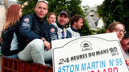 FILE - Danish Driver Allan Simonsen, left, is seen during a parade on the eve of the 90th 24-hour Le Mans endurance race, in Le Mans, western France, in this Friday, June 21, 2013 photo. The No.95 Aston Martin Vantage GTE, driven by Simonsen, exited the track at high speed at the Tertre Rouge corner on his fourth lap of the race, He died after due to his injuries, Saturday, June 22, 2013.(AP Photo/Michel Spingler, File)