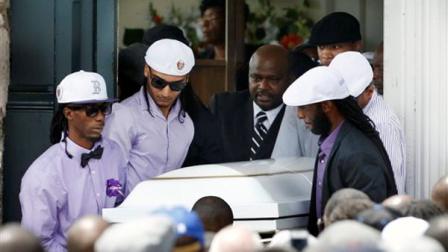 Pallbearers carry the casket of Odin LLoyd following a funeral ceremony at the Church of the Holy Spirit in Boston in Boston, Saturday, June 29, 2013. Hundreds of relatives, friends and well-wishers wept together and hugged at the funeral for LLoyd, a semi-pro football player whose killing led to murder and weapons charges against former New England Patriots player Aaron Hernandez. (AP Photo/Michael Dwyer)