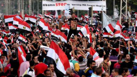 Opponents of Egypts Islamist President Mohammed Morsi chant slogans during a protest outside the presidential palace, in Cairo, Egypt, Monday, July 1, 2013. Egypts military on Monday issued a 48-hour ultimatum to the Islamist president and his opponents to reach an agreement to meet the peoples demands or it will intervene to put forward a political road map for the country and ensure it is carried out. (AP Photo/Hassan Ammar)
