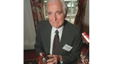Doug Engelbart, inventor of the computer mouse and winner of the half-million dollar 1997 Lemelson-MIT prize poses with the computer mouse he designed, April 9, 1997, in New York. (AP Photo/Michael Schmelling)