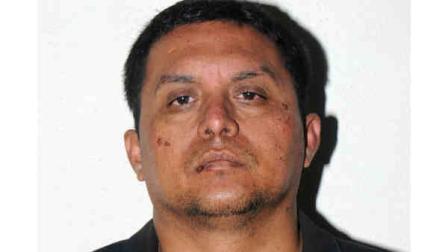 In this photo released on Tuesday, July 16, 2013 by the Mexican Navy, is Zetas drug cartel leader Miguel Angel Trevino Morales after his arrest in Mexico. (AP Photo/Mexican Navy)