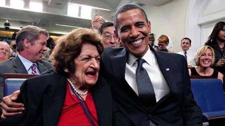 FILE - In this Aug. 4, 2009, file photo, veteran White House reporter Helen Thomas, left, celebrates her 89th birthday with President Barack Obama, celebrating his 48th birthday, in the White House Press Briefing Room in Washington. Thomas, a pioneer for women in journalism and an irrepressible White House correspondent, has died Saturday, July 20, 2013. She was 92. (AP Photo/J. Scott Applewhite, File)