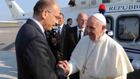 In this photo provided by the Vatican newspaper LOsservatore Romano, Pope Francis greets Italian Premier Enrico Letta at Romes Leonardo Da Vinci international airport, Monday, July 22, 2013. Its wheels up on Pope Francis first trip abroad as pontiff. A special Alitalia flight carrying Francis, his entourage and journalists who will cover him on his week-long visit to Brazil took off 10 minutes behind schedule Monday from Romes Leonardo da Vinci airport.