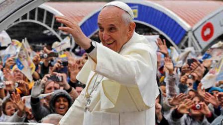 Pope Francis waves to pilgrims from his popemobile as he arrives to the Aparecida Basilica in Aparecida, Brazil, Wednesday, July 24, 2013. Tens of thousands of faithful flocked to the tiny town of Aparecida, tucked into an agricultural region halfway between Rio de Janeiro and Sao Paulo, where he is to celebrate the first public Mass of his trip in a massive basilica dedicated to the nations patron saint. (AP Photo/Enric Marti)