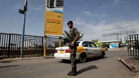 A policeman stands guard at the entrance of Sanaa International Airport, Yemen, Wednesday, Aug. 7, 2013. The State Department on Tuesday ordered non-essential personnel at the U.S. Embassy in Yemen to leave the country. The department said in a travel warning that it had ordered the departure of non-emergency U.S. government personnel from Yemen due to the continued potential for terrorist attacks and said U.S. citizens in Yemen should leave immediately because of an extremely high security threat level. (AP Photo/Hani Mohammed)