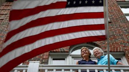 Joan Darrah, left, who served nearly 30 years in the Navy and lived through the Sept. 11 attack of the Pentagon, and her spouse, Lynne Kennedy, pose for a photo at their home in Alexandria, Va., Thursday, June 27, 2013. Just two years ago, gays were prevented from openly serving in the military. Now, with the Supreme Court ruling, same-sex spouses of gay veterans and service members will be able to share in their benefits. (AP Photo/Charles Dharapak)