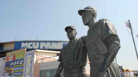 This undated image provided by the Brooklyn Cyclones shows a statue of Pee Wee Reese and Jackie Robinson at MCU Park in the Coney Island section of the Brooklyn borough of New York, where the minor league Cyclones team plays. (AP Photo/Brooklyn Cyclones)