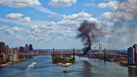 A cloud of smoke billows from the Ed Koch Queensboro Bridge, as seen from Waterside Plaza, on the east side of New York, Friday, Aug. 16, 2013, after a truck caught fire on the bridge. There were no reports of injuries but traffic delays were reported on the major crossing between Manhattan and Queens. (AP Photo/Frank Ritter)