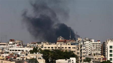 Black columns of smoke rise from heavy shelling in the Jobar neighborhood, east of Damascus, Syria, Sunday, Aug. 25, 2013. Syria reached an agreement with the United Nations on Sunday to allow a U.N. team of experts to visit the site of alleged chemical weapons attacks last week outside Damascus, state media said. (AP Photo/Hassan Ammar)