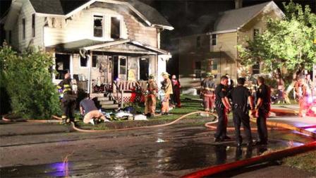 Police and firefighters work at the site of a house fire which killed four people in Elmira, N.Y. on Friday, Aug. 30, 2013. Police say firefighters pulled four victims from the building and took them to the hospital, but none survived the night. The cause was under investigation. (AP Photo/Elmira Star-Gazette, Ron Levanduski)