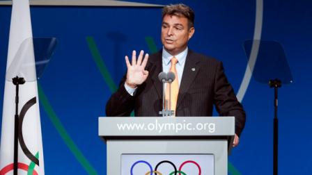 Antonio Castro, right, son of Cubas Fidel Castro and member of the World Baseball Baseball and Softball Confederation (WBSC), speaks during the sports presentation during the 125th IOC session in Buenos Aires, Argentina, Sunday, Sept. 8, 2013. During the meeting members will elect a new sport choosing between wrestling, squash and baseball, that is presenting a joint bid with softball.(AP Photo/Victor R. Caivano)