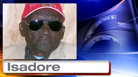 In this 2011 photo provided by the Pine Bluff Commercial, Monroe Isadore poses for photos on his 105th birthday in Pine Bluff, Ark. Authorities in Arkansas halted a standoff on Saturday, Sept. 7, 2013, when they shot and killed Isadore, 107, who opened fire at them. (AP Photo/Courtesy Pine Bluff Commercial)