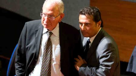 Captain Francesco Schettino, right, and his lawyer Francesco La Mattina leave during a pause of his trial in the court room of the converted Teatro Moderno theater for his trial, in Grosseto, Italy, Monday, Sept. 23, 2013. (AP Photo/Andrew Medichini)