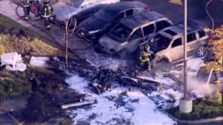 Authorities say one person was killed and another injured when a single-engine plane crashed in a bank parking lot in suburban Chicago.