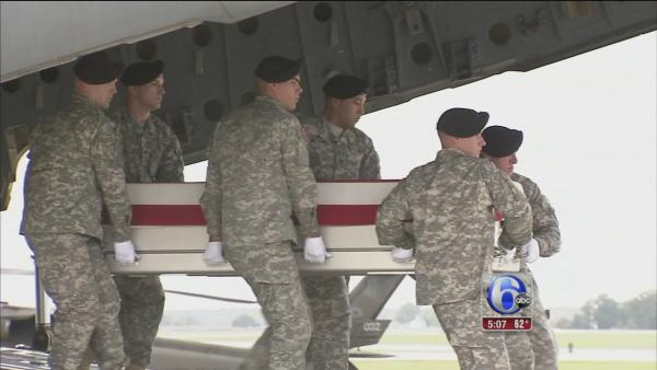 Hagel attends arrival of 4 war dead in Del.