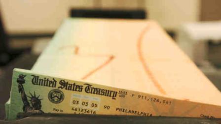 FILE - In this Feb. 11, 2005 file photo, trays of printed social security checks wait to be mailed from the U.S. Treasurys Financial Management services facility in Philadelphia. (AP Photo/Bradley C. Bower, File)