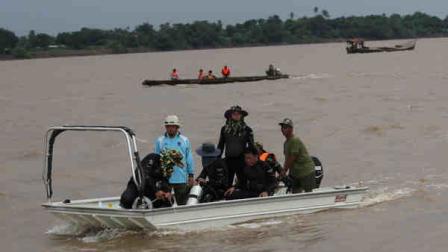 Rescue workers search bodies of plane crash victims by boats in the Mekong River in Pakse, Laos Friday, Oct. 18, 2013. Lao Airlines flight QV301 crashed Wednesday as it prepared to land in stormy weather at Pakse Airport in southern Laos. All 49 people on board, more than half of whom were foreigners, are presumed dead. (AP Photo/Sakchai Lalit)