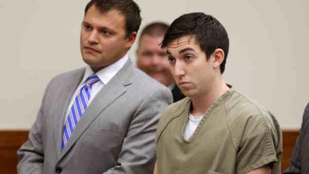 Matthew Cordle, right, stands before a judge during sentencing Wednesday, Oct. 23, 2013, in Columbus, Ohio. The judge sentenced Cordle to 6 1/2 years in prison for causing a fatal wrong-way crash after a night of heavy drinking, which he confessed to in an online video. Defense attorney George Breimayer, left, listens. (AP Photo/Tony Dejak)