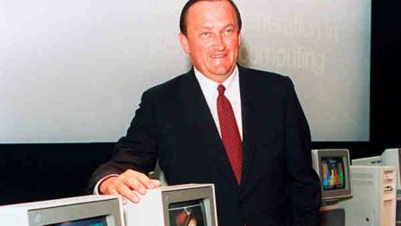 FILE - In this Aug. 4, 1987 file photo, William C. Lowe, a vice president at IBM, poses with two of the companys newest Personal System/2 computers, the model 25, at the unveiling in New York City. Lowe, who led development of first IBM personal computer, died on Oct. 19, 2013, in Lake Forest, Ill., of a heart attack, his daughter Michelle Marshall said. He was 72. (AP Photo/Richard Drew)