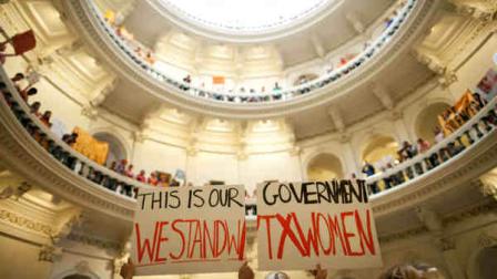 FILE - In this July 12, 2013 file photo, abortion rights supporters rally on the floor of the State Capitol rotunda in Austin, Texas. New abortion restrictions passed by the Texas Legislature are unconstitutional and will not take effect as scheduled on Tuesday, Oct. 29, 2013, a federal judge has ruled. (AP Photo/Tamir Kalifa, File)