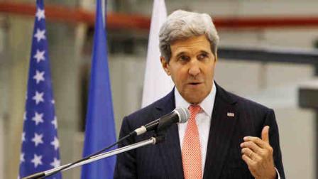 U.S. Secretary of State John Kerry addresses Polish and stationing U.S. airmen at an air base in Lask, Poland, on Tuesday, Nov.5, 2013. (AP Photo/Czarek Sokolowski)