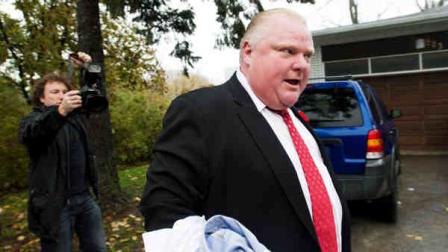 Toronto Mayor Rob Ford tells to the media to get off his property as he leaves his home in Toronto on Thursday, Oct. 31, 2013. (AP Photo/, Nathan Denette)