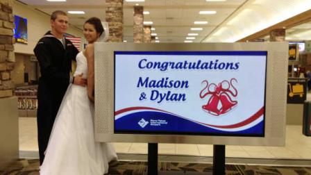 In this photo courtesy of Heidi Jared taken on Tuesday, Nov. 19, 2013, U.S. Navy seaman Dylan Ruffer and his fiancee, Madison Meinhardt, both from Chester, Calif., pose after getting married in front of the baggage area at the Reno-Tahoe International Airport in Reno, Nev. (AP Photo/Courtesy Heidi Jared)