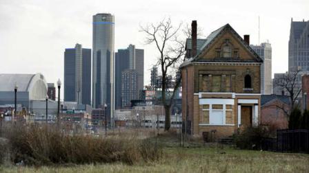 In a photo from Monday, Dec. 2, 2013, an empty field in Brush Park, north of Detroits downtown is shown with an abandoned home.(AP Photo/Carlos Osorio, File)