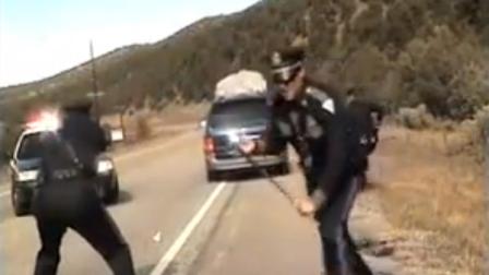 Three New Mexico State Police officers react as a minivan driven by motorist Oriana Farrell pulls away from a chaotic traffic stop that included one officer bashing the vanā??s window with his night stick and another, Elias Montoya, at left, firing three shots as the van drives off, in this video made Oct. 28, from the dashboard camera of the police cruiser. Montoya, the officer who fired at the van full of children, has been suspended. (AP Photo/New Mexico State Police)