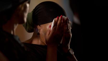 A worshipper wipes her tears during a memorial service for deceased South African leader Nelson Mandela at the Bryanston Methodist Church in Bryanston suburb of Johannesburg, South Africa, Sunday Dec. 8, 2013. South Africa is readying itself for the arrival of a flood of world leaders for the memorial service and funeral for Nelson Mandela as thousands of mourners continued to flock to sites around the country Saturday to pay homage to the freedom struggle icon. (AP Photo/Peter Dejong)