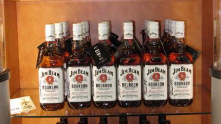 This Oct. 3, 2012 photo shows shelves stocked with Jim Beam products at the central Kentucky distillerys new visitors center in Clermont, Ky. Bourbon distilleries are drawing flocks of fans, and the whiskey makers are building new visitors centers to promote their brands. (AP Photo/Bruce Schreiner)