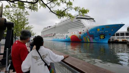 FILE - In this May 8, 2013, file photo, people pause to look at Norwegian Cruise Lines new ship, Norwegian Breakaway, on the Hudson River, in New York. A 4-year-old child died after being pulled unresponsive from a swimming pool on the Norwegian Breakaway, off the coast of North Carolina on Monday, Feb. 3, 2014, cruise line and Coast Guard officials said. Crew members were able to revive a 6-year-old boy also found in the pool. He was airlifted to a hospital, where his condition was unknown. (AP Photo/Richard Drew, File)