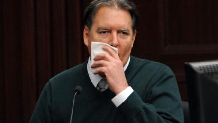 Defendant Michael Dunn becomes emotional when talking about his fiancee and their dog as he takes the stand in his own defense during his trial, Tuesday, Feb. 11, 2014, in Jacksonville, Fla. Dunn is charged with killing Jordan Davis after an argument over loud music outside a Jacksonville convenience store in 2012. (AP Photo/The Florida Times-Union, Bob Mack, Pool)