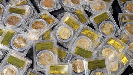 Some of 1,427 Gold-Rush era U.S. gold coins are displayed at Professional Coin Grading Service in Santa Ana, Calif., Tuesday, Feb. 25, 2014. A California couple out walking their dog on their property stumbled across the modern-day bonanza: $10 million in rare, mint-condition gold coins buried in the shadow of an old tree. Nearly all of the 1,427 coins, dating from 1847 to 1894, are in uncirculated, mint condition, said David Hall, co-founder of Professional Coin Grading Service, who recently authenticated them. Although the face value of the gold pieces only adds up to about $27,000, some of them are so rare that coin experts say they could fetch nearly $1 million apiece. (AP Photo/Reed Saxon)