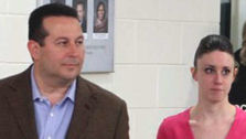 Casey Anthony, right, walks out of the Orange...