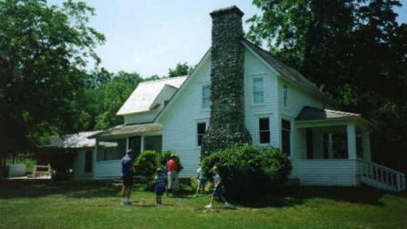 This is David and his family outside the Wilder home in Mansfield, Missouri, where the Little House On The Prairie books were written.