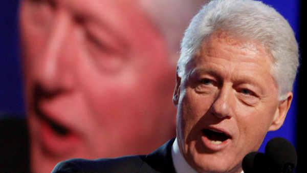Former President Bill Clinton addresses the crowd as he takes the stage during the Democratic National Convention in Denver, Wednesday, Aug. 27, 2008.